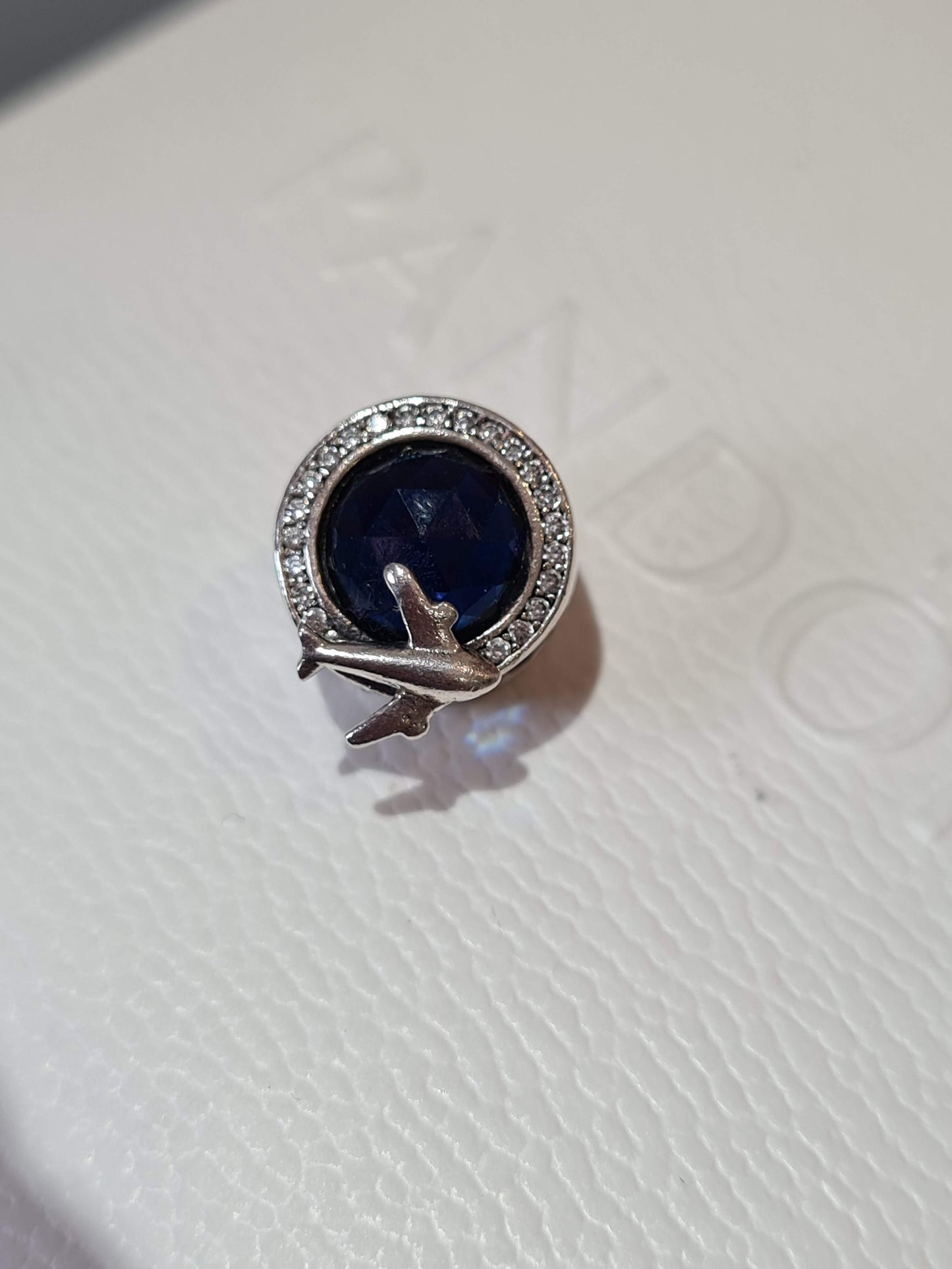 Genuine Silver Travel Charm With Beauiful Blue Stone and Aeroplane Detail.
