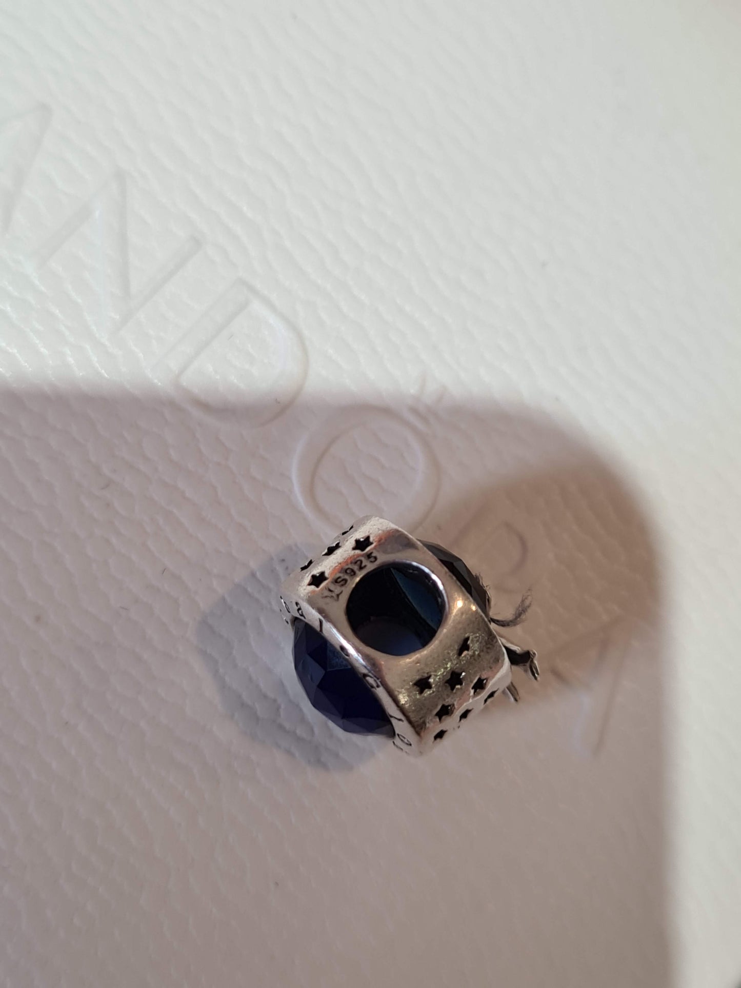 Genuine Silver Travel Charm With Beauiful Blue Stone and Aeroplane Detail.