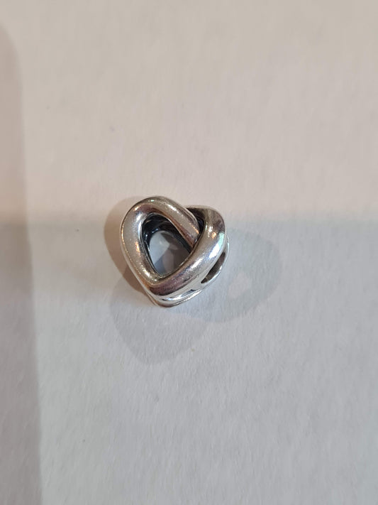 Genuine Pandora Beautiful Openwork Heart Twist Charm.
