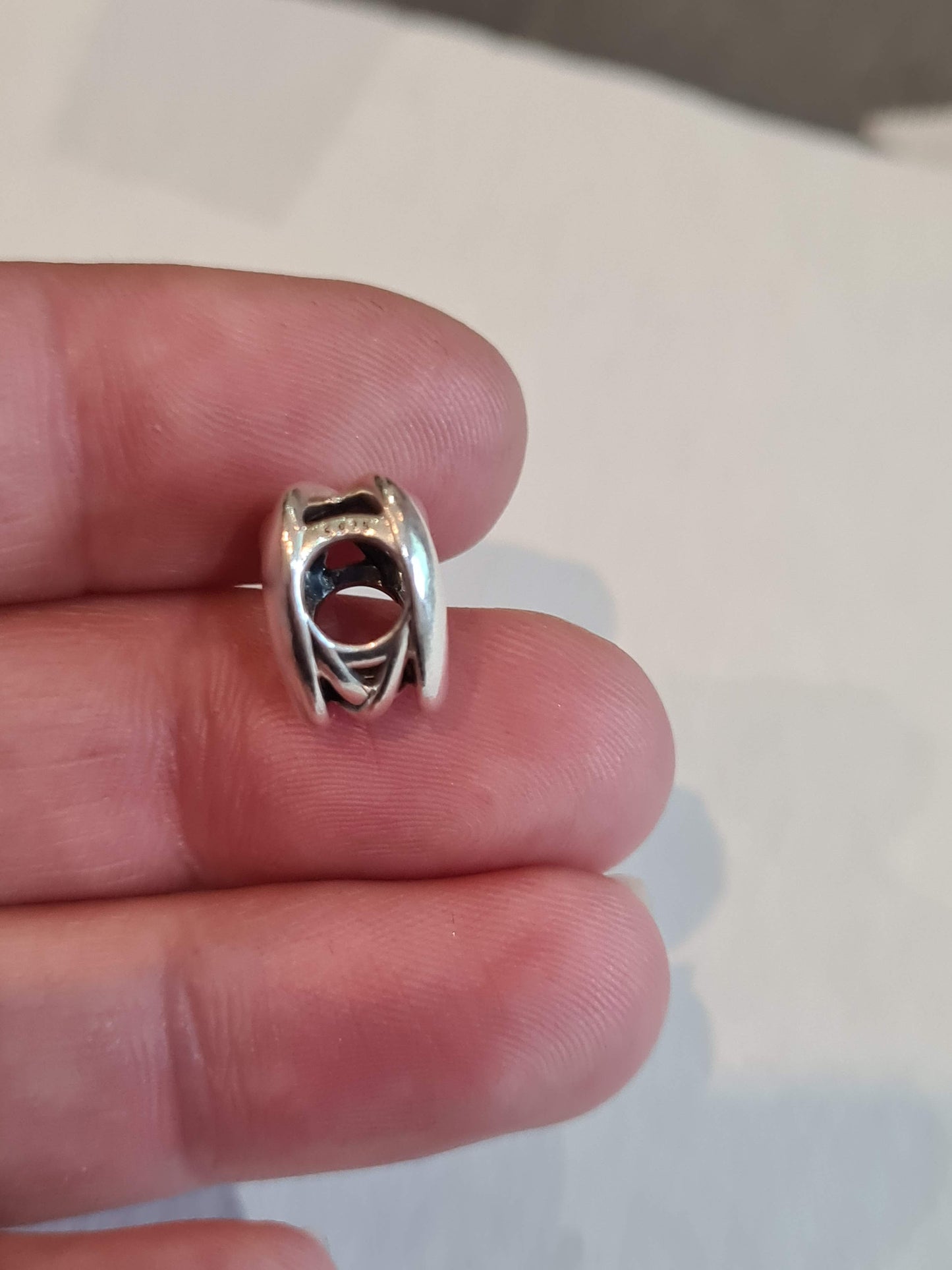Genuine Pandora Beautiful Openwork Heart Twist Charm.