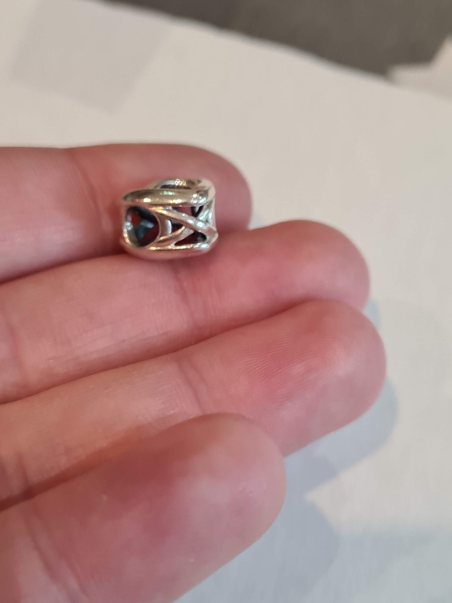 Genuine Pandora Beautiful Openwork Heart Twist Charm.