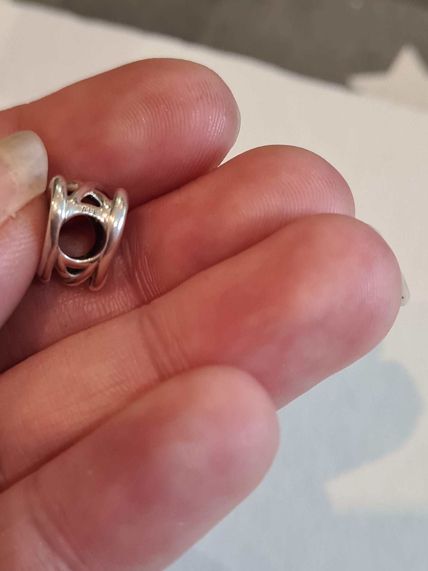 Genuine Pandora Beautiful Openwork Heart Twist Charm.