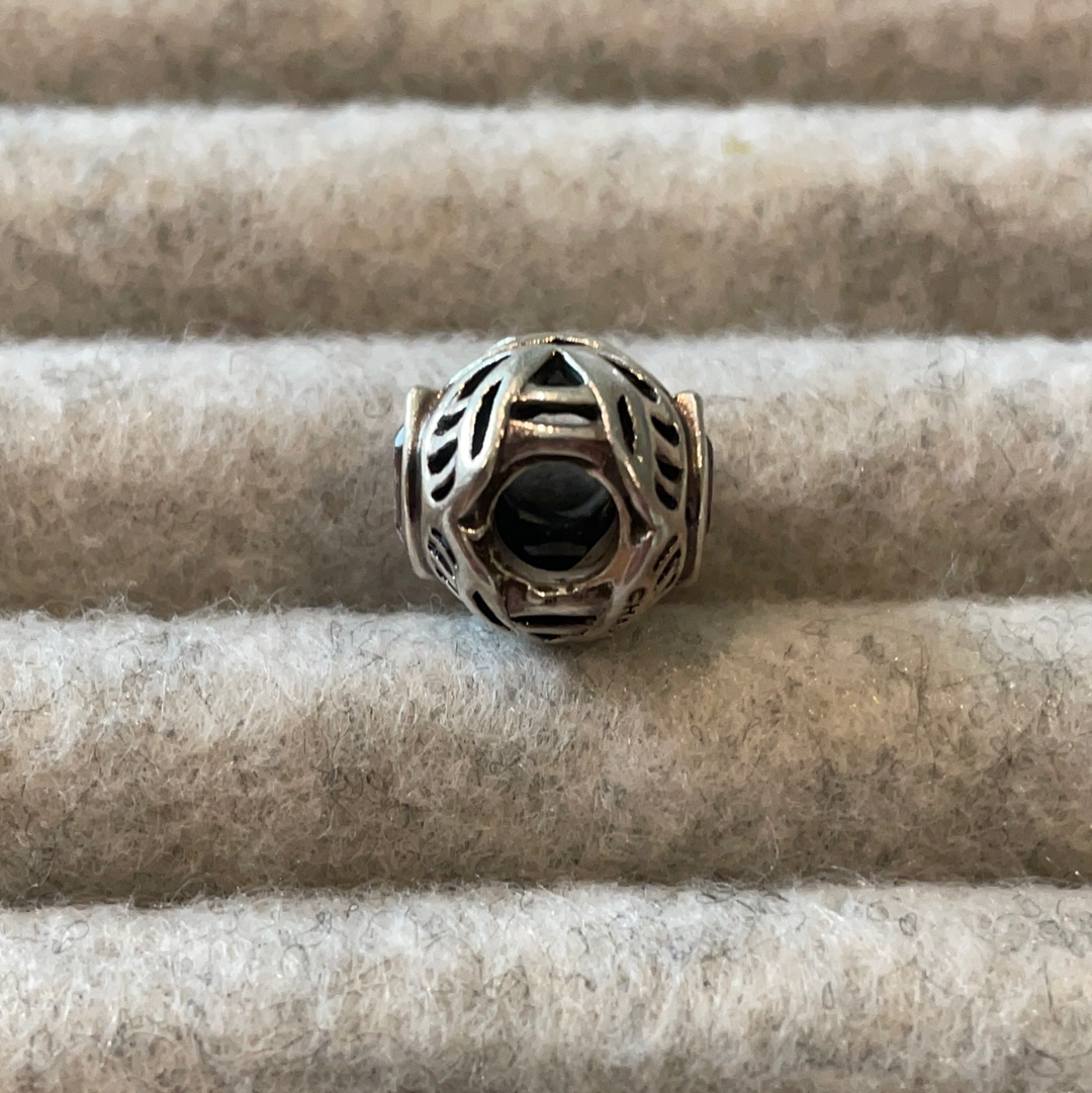 Genuine Chamilia open work charm with purple stone