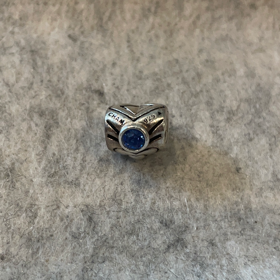 Genuine Chamilia heart charm with blue stone