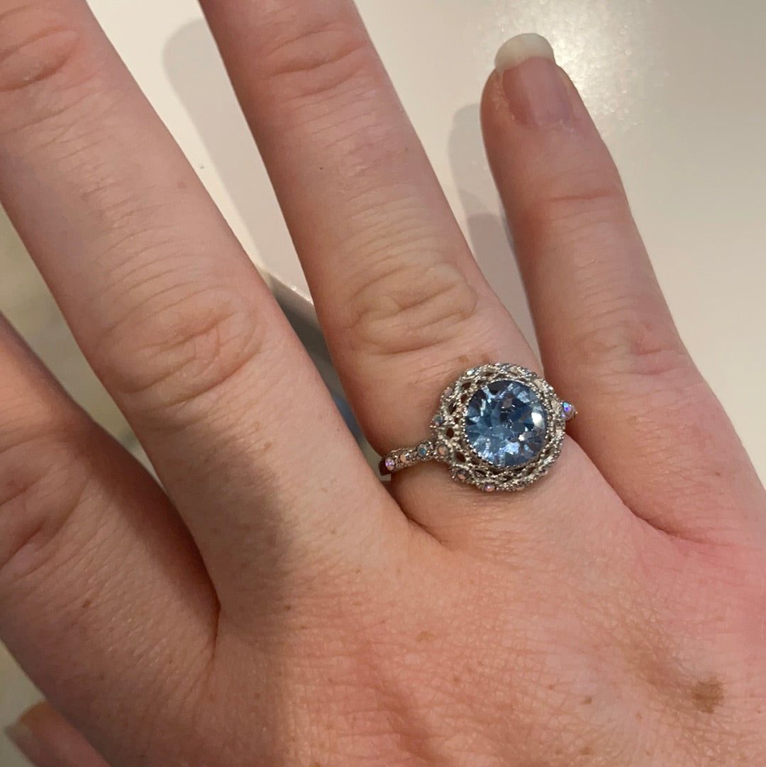 Brand New Sterling Silver Beautiful Ring With Clear Pave Stones Surrounding a Large Faceted Light Blue Stone Size 57