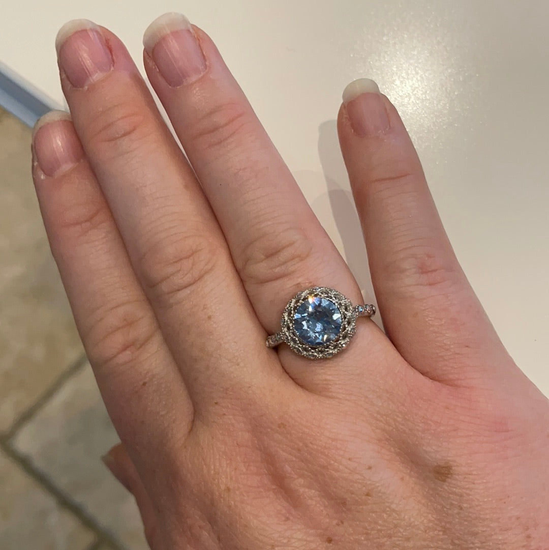 Brand New Sterling Silver Beautiful Ring With Clear Pave Stones Surrounding a Large Faceted Light Blue Stone Size 57