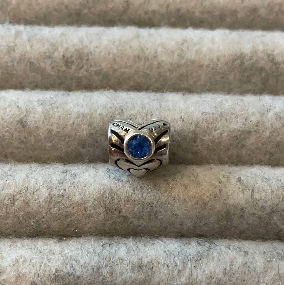 Genuine Chamilia heart charm with blue stone