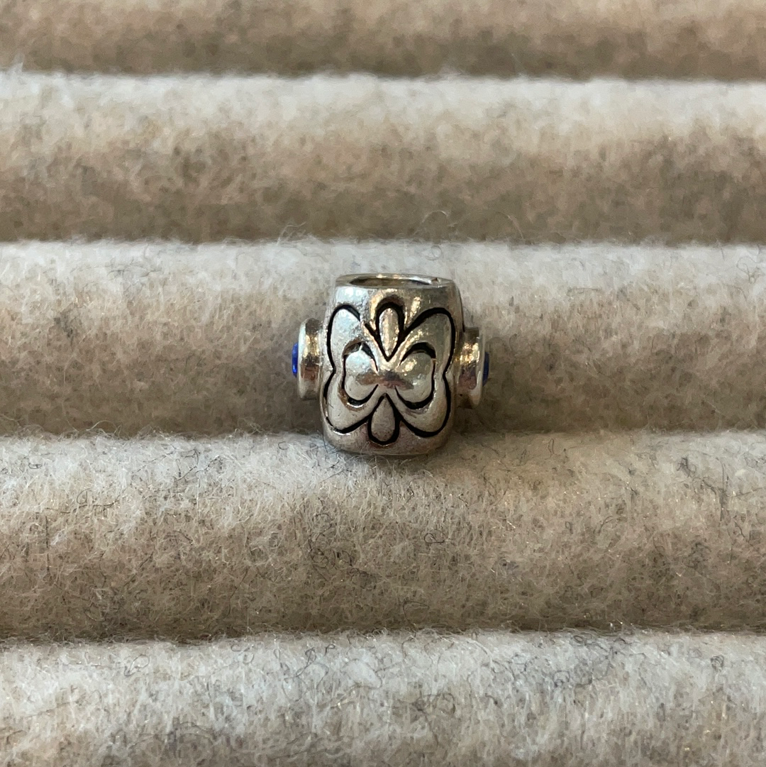 Genuine Chamilia heart charm with blue stone