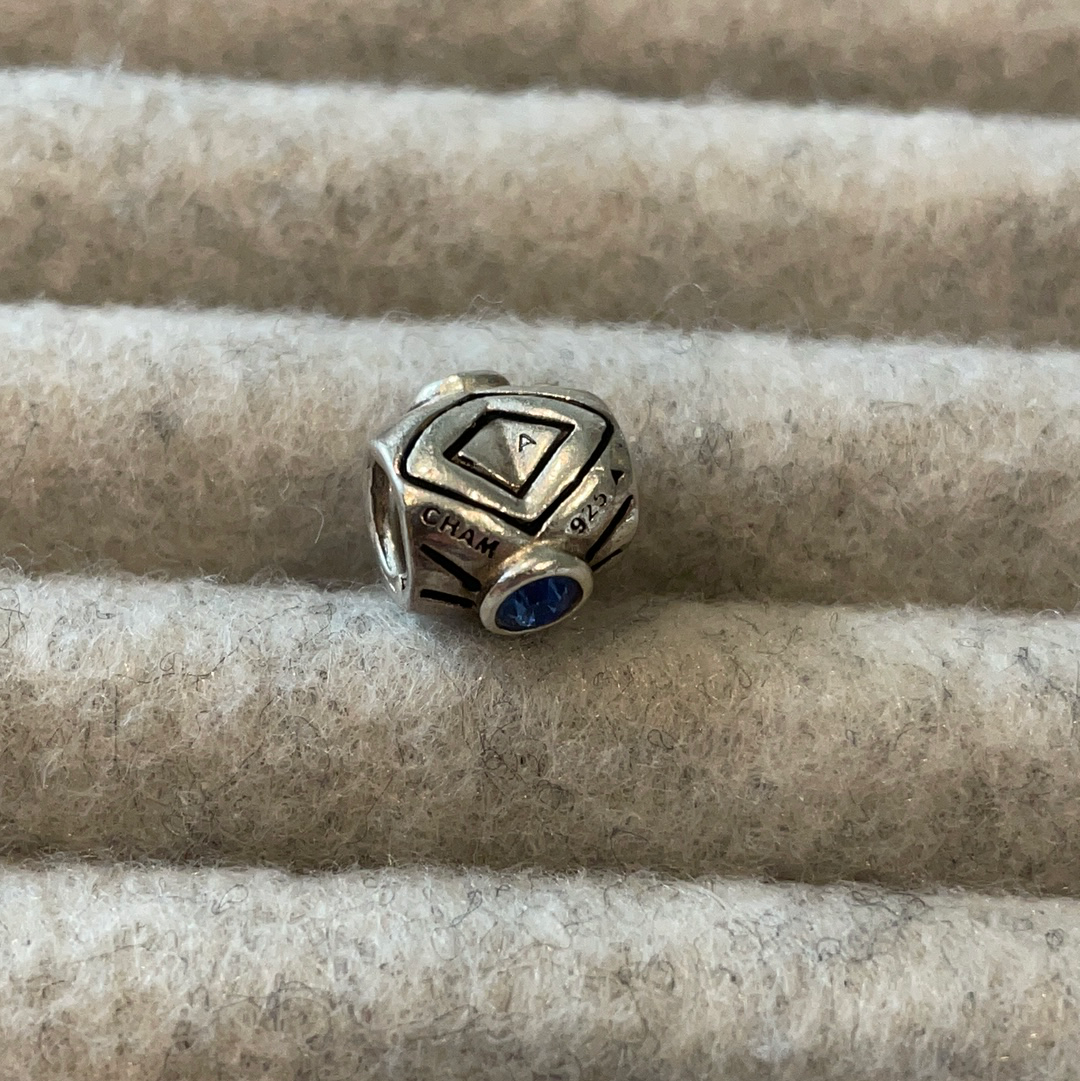 Genuine Chamilia heart charm with blue stone