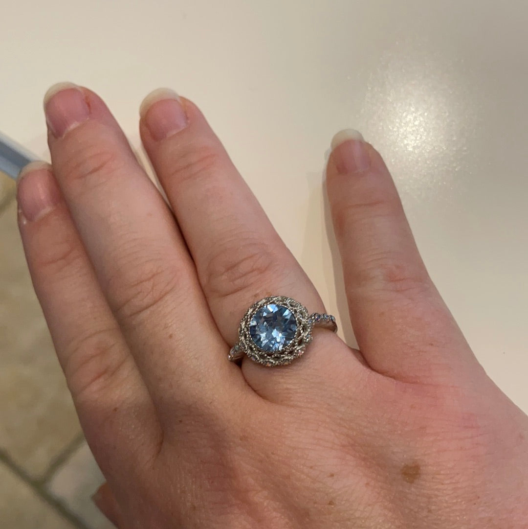 Brand New Sterling Silver Beautiful Ring With Clear Pave Stones Surrounding a Large Faceted Light Blue Stone Size 57